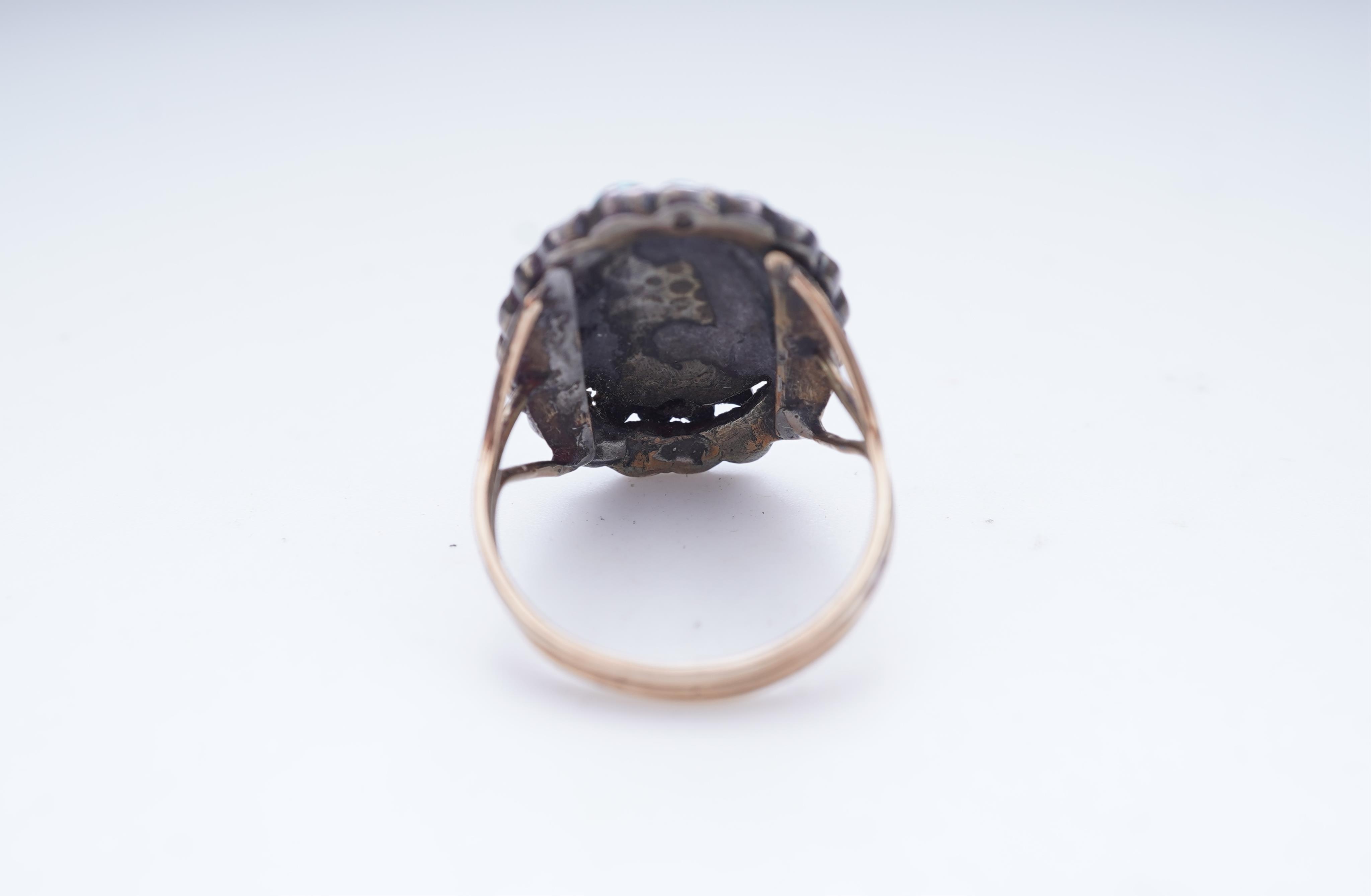 An enamel miniature, turquoise and garnet ring